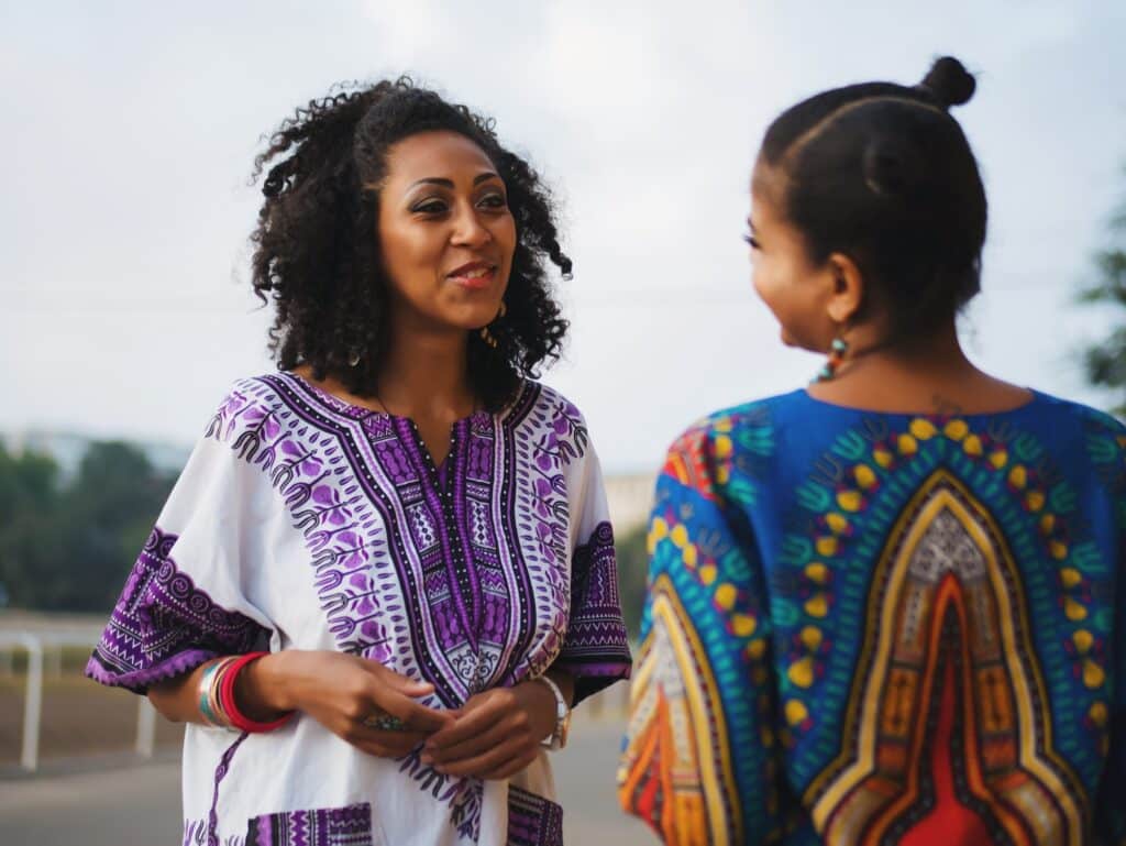Portrait of young Afro women have conversation outdoors . Friends, friendship, African culture