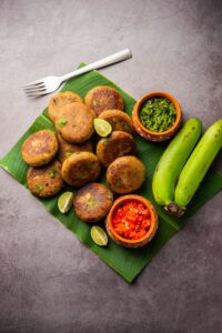 Raw Banana Cutlet also called unripe plantain or kacche kele ki tikki or patties, served with chutney